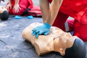 CPR certification blog: CPR Level C vs BLS gloved hands chest compressions